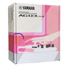 Load image into Gallery viewer, Yamaha AG03 MK2 Live Streaming Mixer retail packaging box, featuring a white and pink design with an illustration of a hand adjusting knobs.