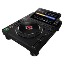 Load image into Gallery viewer, Angled side view of AlphaTheta Pioneer CDJ-3000X professional DJ media player, showing large 9-inch touchscreen display with waveforms, jog wheel, cue and play buttons, and full performance controls for club DJs