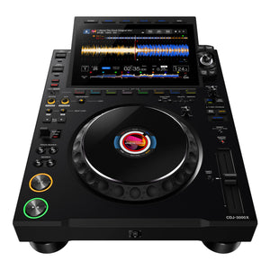 Birds eye view of AlphaTheta Pioneer CDJ-3000X professional DJ media player, showing large 9-inch touchscreen display with waveforms, jog wheel, cue and play buttons, and full performance controls for club DJs